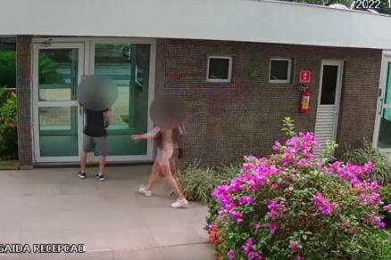 O casal deixando o edifcio, localizado no Duque de Caxias