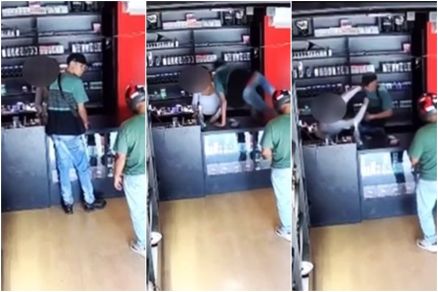 Imagem de segurana mostra momento em que dois homens imobilizam a funcionria durante o assalto
