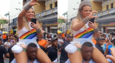 Carla Perez subiu nos ombros de um seguran�a negro durante passagem do seu trio el�trico em Salvador e foi criticada